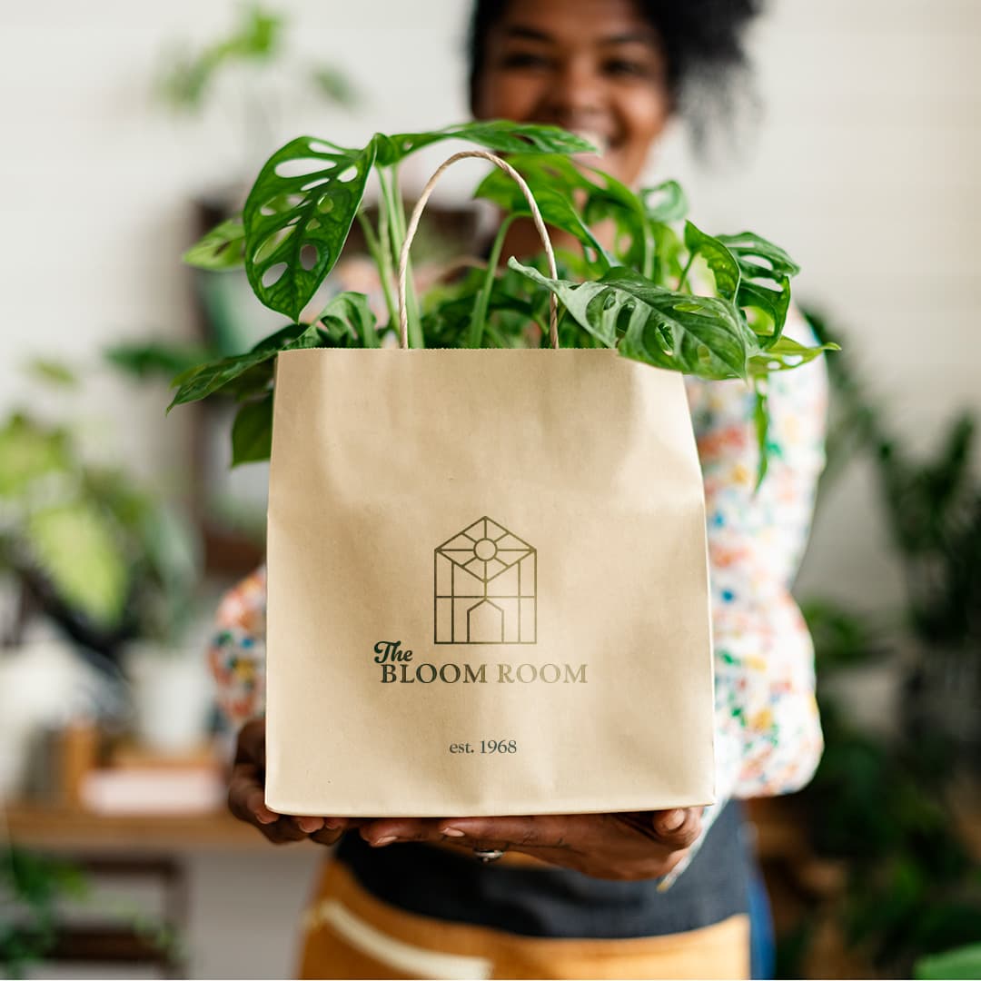 The Bloom Room logo on paper bag